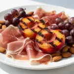 grilled peach prosciutto charcuterie board - featured image